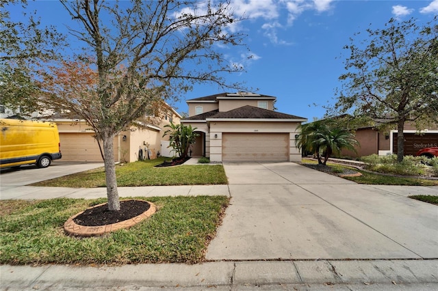 traditional home with concrete driveway, a garage, and stucco siding