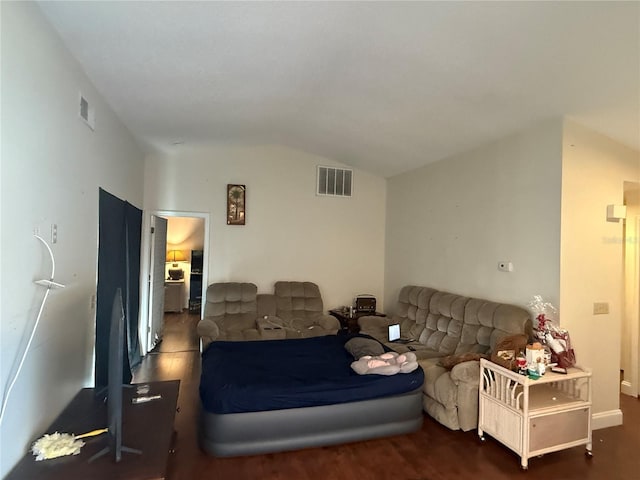 living room with lofted ceiling and dark hardwood / wood-style flooring