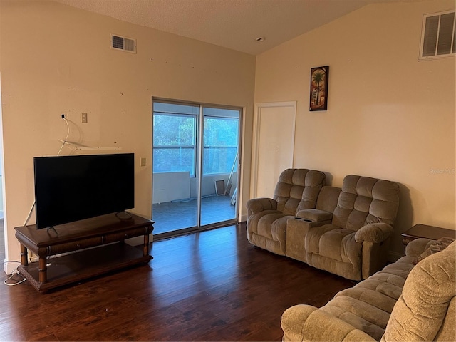 living room with vaulted ceiling and dark hardwood / wood-style floors