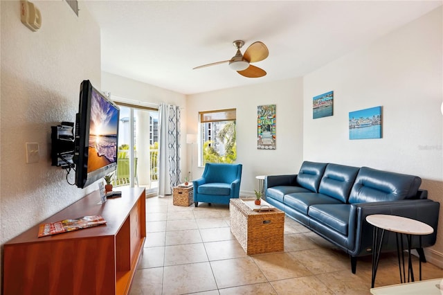 tiled living room featuring ceiling fan