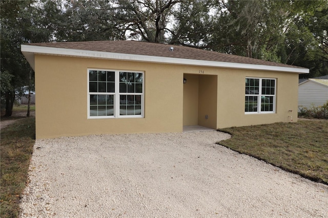 ranch-style house with a front yard