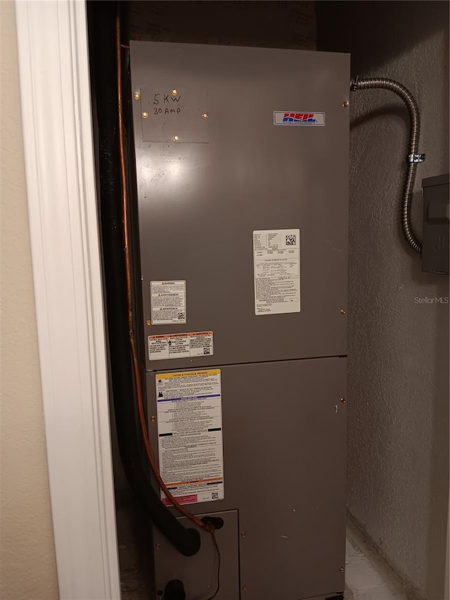 utility room with heating unit