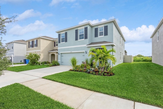 view of front of property featuring a garage and a front yard