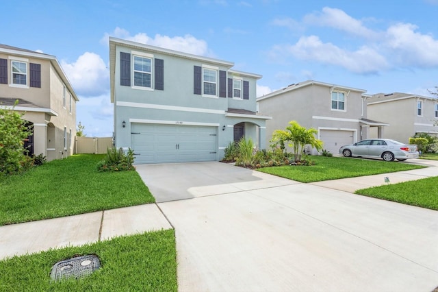 view of front of property with a front lawn and a garage