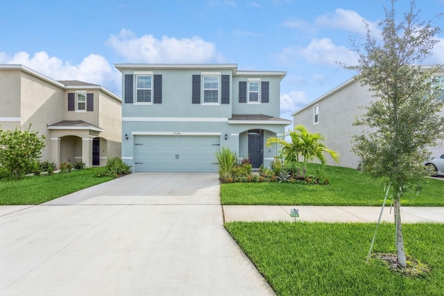 view of front of house featuring a front yard and a garage