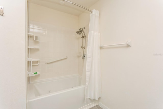 bathroom featuring shower / bath combo with shower curtain