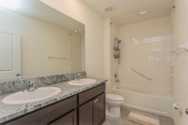 full bathroom with vanity, toilet, tile patterned flooring, and shower / bathing tub combination