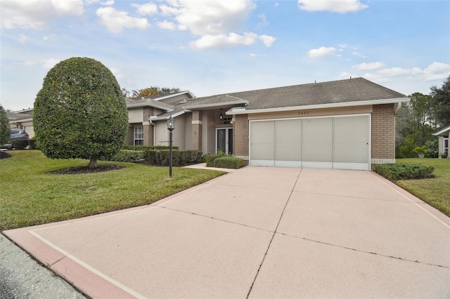 view of front of home featuring a garage and a front yard