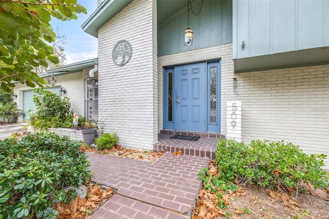 view of exterior entry featuring a garage