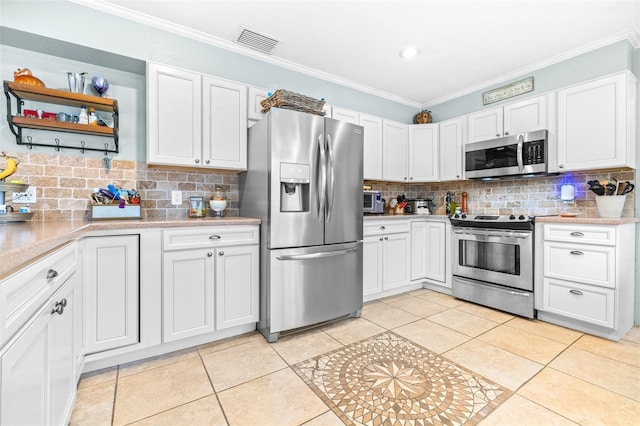 kitchen featuring stainless steel appliances and white cabinetry