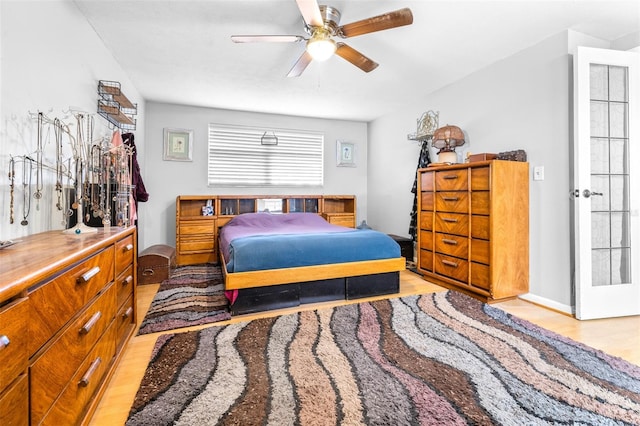 bedroom featuring ceiling fan and light wood-type flooring