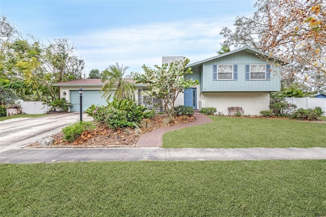 view of front of home featuring a garage and a front lawn