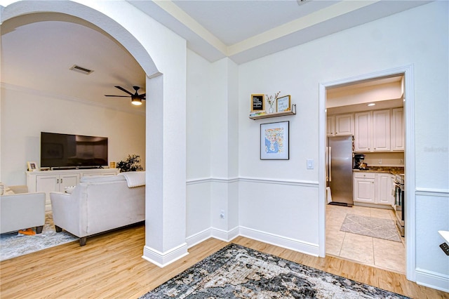 interior space featuring ceiling fan and light hardwood / wood-style flooring