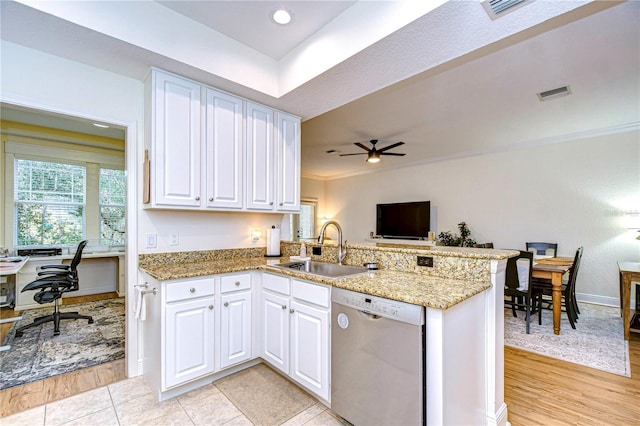 kitchen featuring sink, white cabinets, and dishwasher