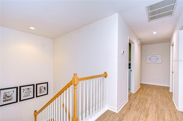 hall with light hardwood / wood-style floors