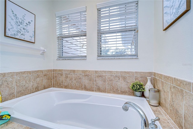 bathroom with tiled bath