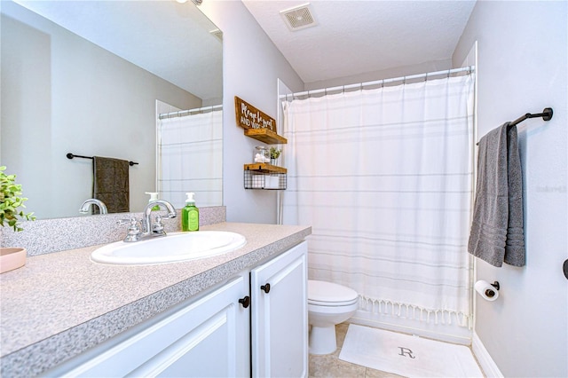 bathroom with curtained shower, toilet, vanity, and tile patterned flooring