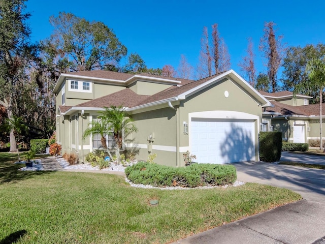 view of front of home with a garage and a front yard