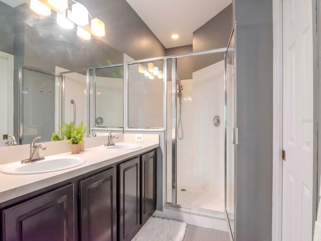 bathroom with vanity and an enclosed shower