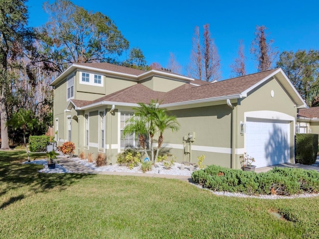 view of front of house featuring a garage and a front yard