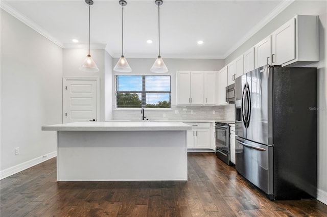 kitchen with white cabinetry, a center island, hanging light fixtures, and appliances with stainless steel finishes