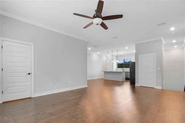 unfurnished living room with ceiling fan, crown molding, and hardwood / wood-style floors