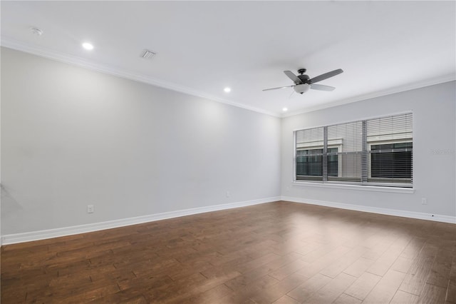 empty room featuring ceiling fan, dark hardwood / wood-style floors, and ornamental molding