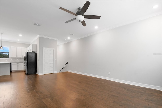 unfurnished living room featuring ceiling fan, ornamental molding, and dark hardwood / wood-style flooring