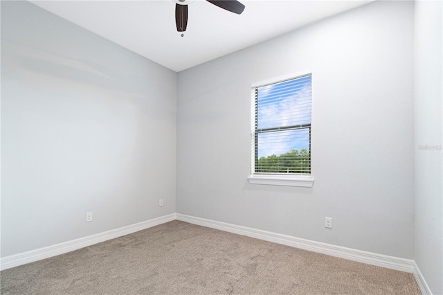 unfurnished room with light carpet and ceiling fan