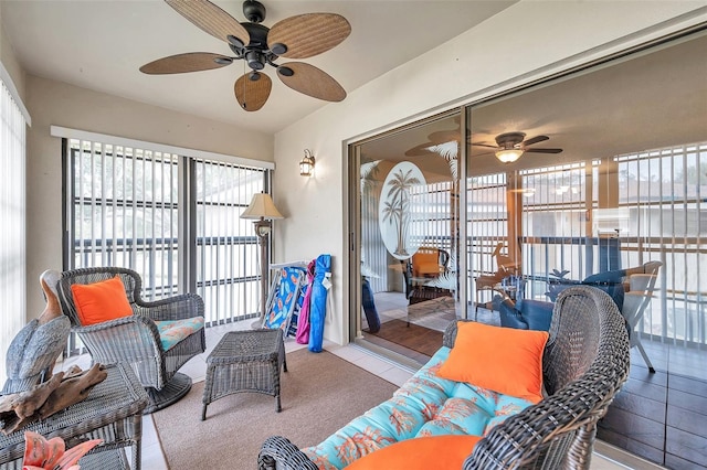 sunroom featuring ceiling fan