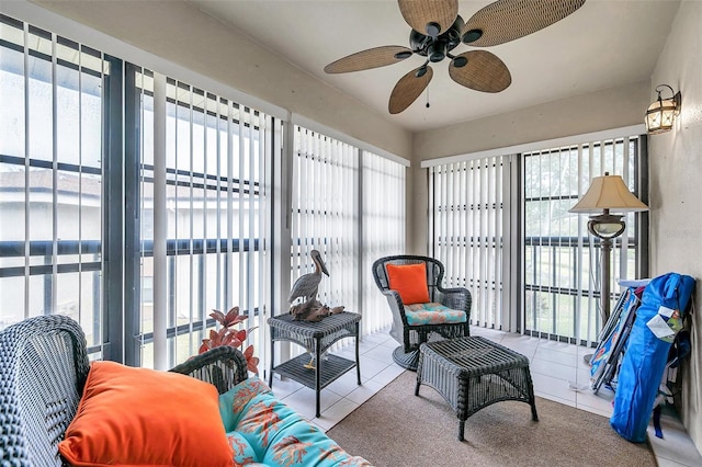 sunroom / solarium featuring ceiling fan and a healthy amount of sunlight