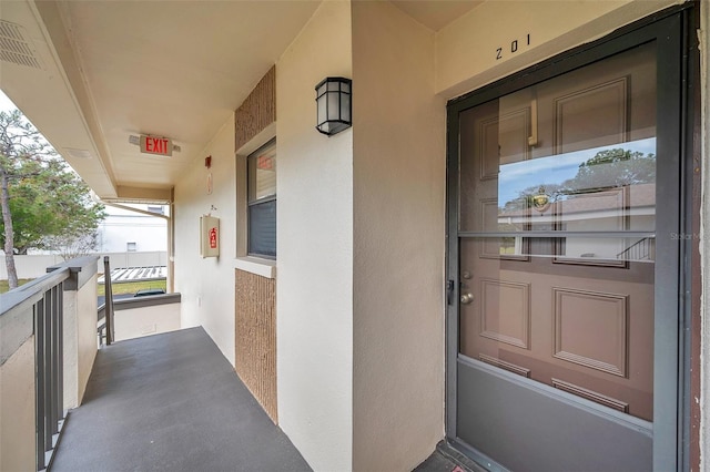 2700 Nebraska Ave Unit 3-201, Palm Harbor, FL 34684 - entrance to property featuring stucco siding and a balcony