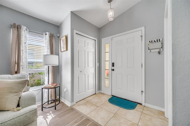 entryway featuring light tile patterned flooring