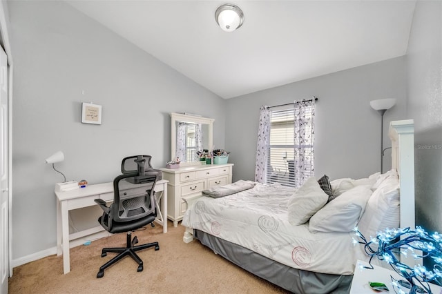 carpeted bedroom featuring lofted ceiling