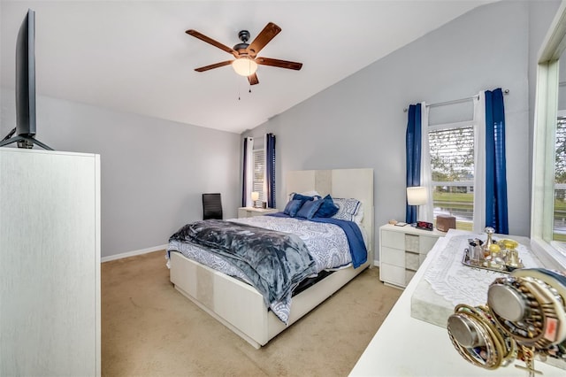 bedroom featuring ceiling fan, light carpet, and vaulted ceiling