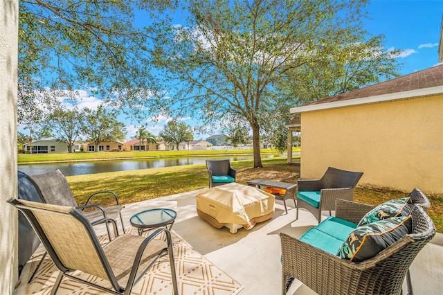 view of patio with a water view