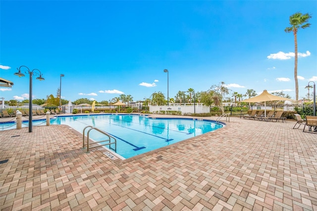 view of swimming pool with a patio area