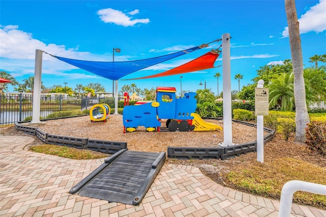 view of playground with a water view