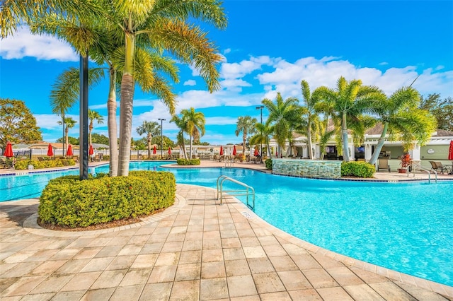 view of swimming pool with a patio area