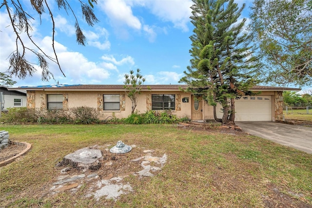 single story home featuring a front lawn and a garage