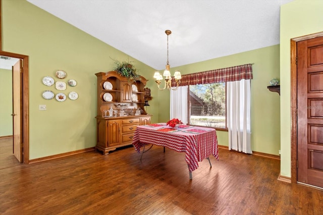 dining area with vaulted ceiling, an inviting chandelier, and dark hardwood / wood-style floors