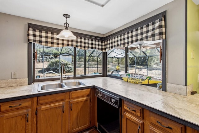 kitchen with pendant lighting, dishwasher, and sink