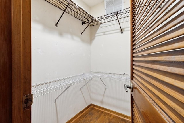 spacious closet featuring hardwood / wood-style floors