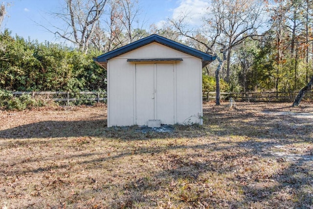 view of outdoor structure featuring a lawn