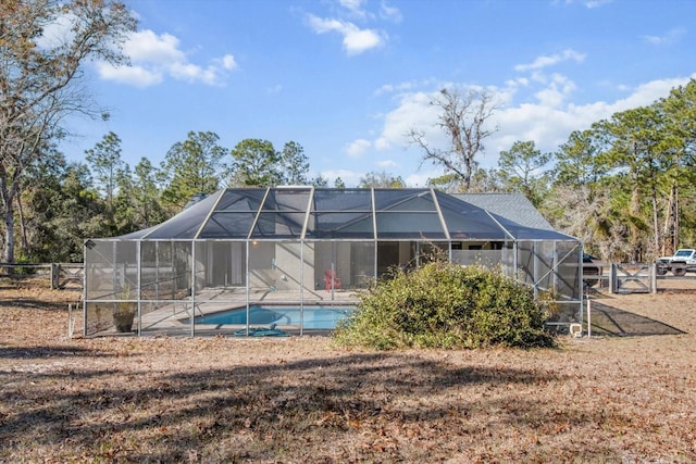 rear view of property with glass enclosure