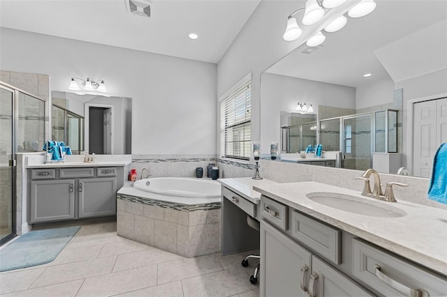 bathroom featuring separate shower and tub, vanity, and tile patterned floors