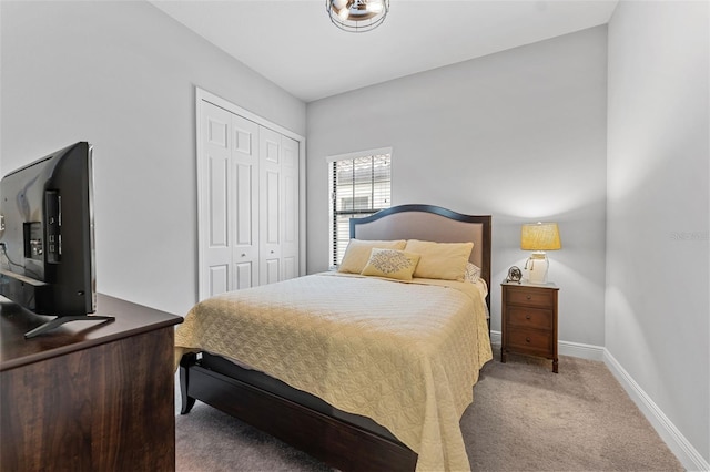 bedroom featuring a closet and carpet flooring