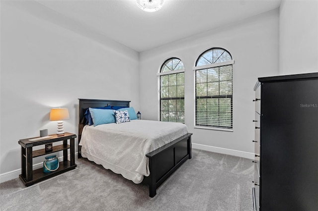 bedroom with light carpet