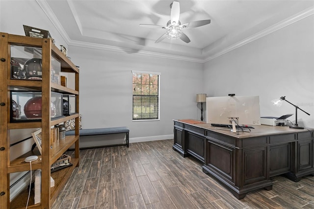 office area featuring ceiling fan, ornamental molding, and a raised ceiling