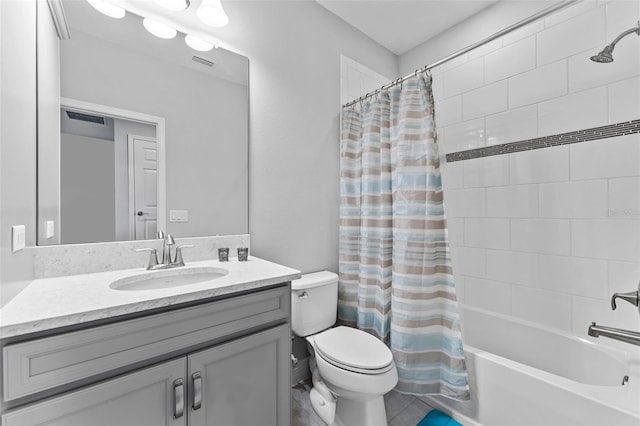 full bathroom featuring shower / bath combo with shower curtain, toilet, and vanity